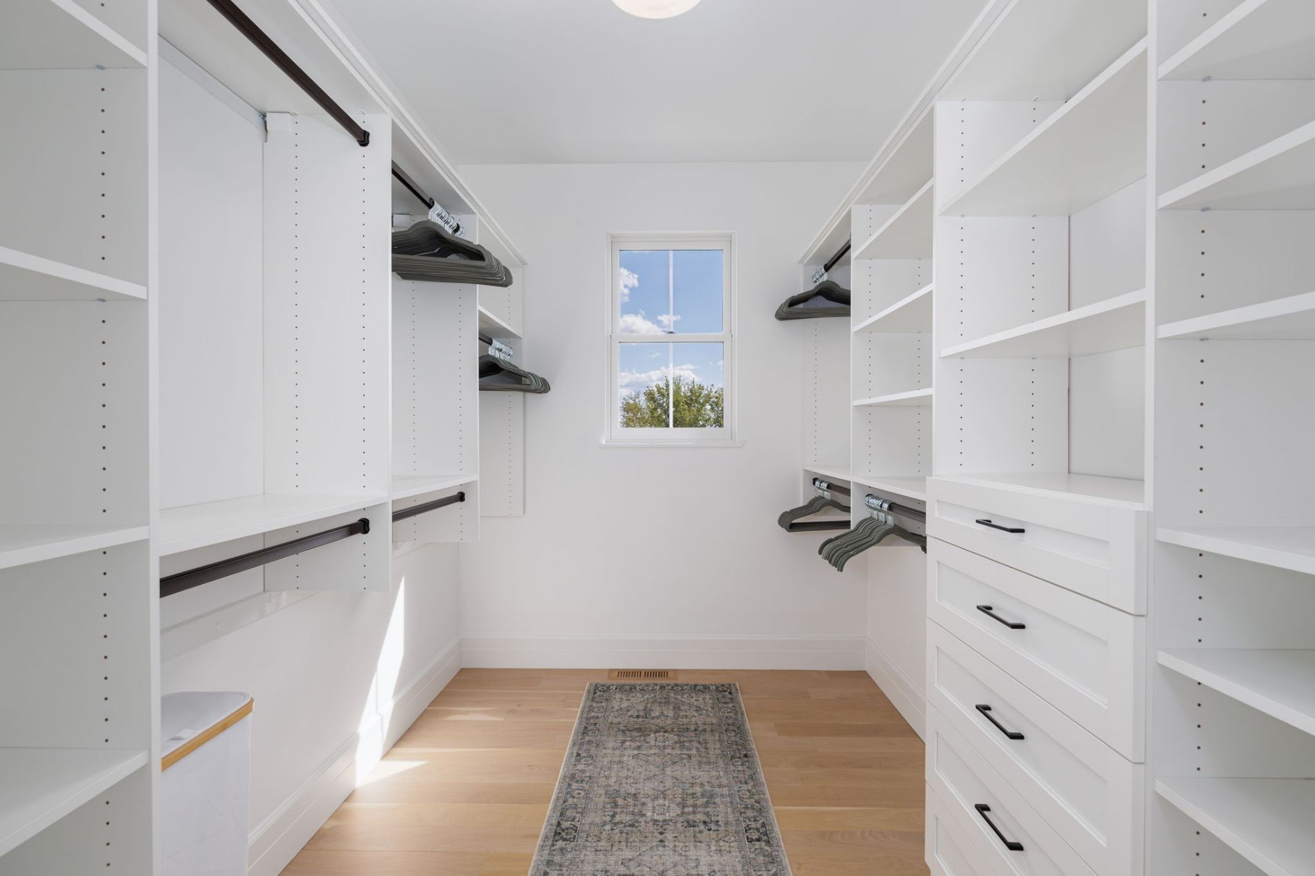 Spacious Primary Walk-In Closet with Custom Built-Ins
